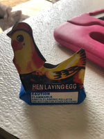 Hen laying eggs